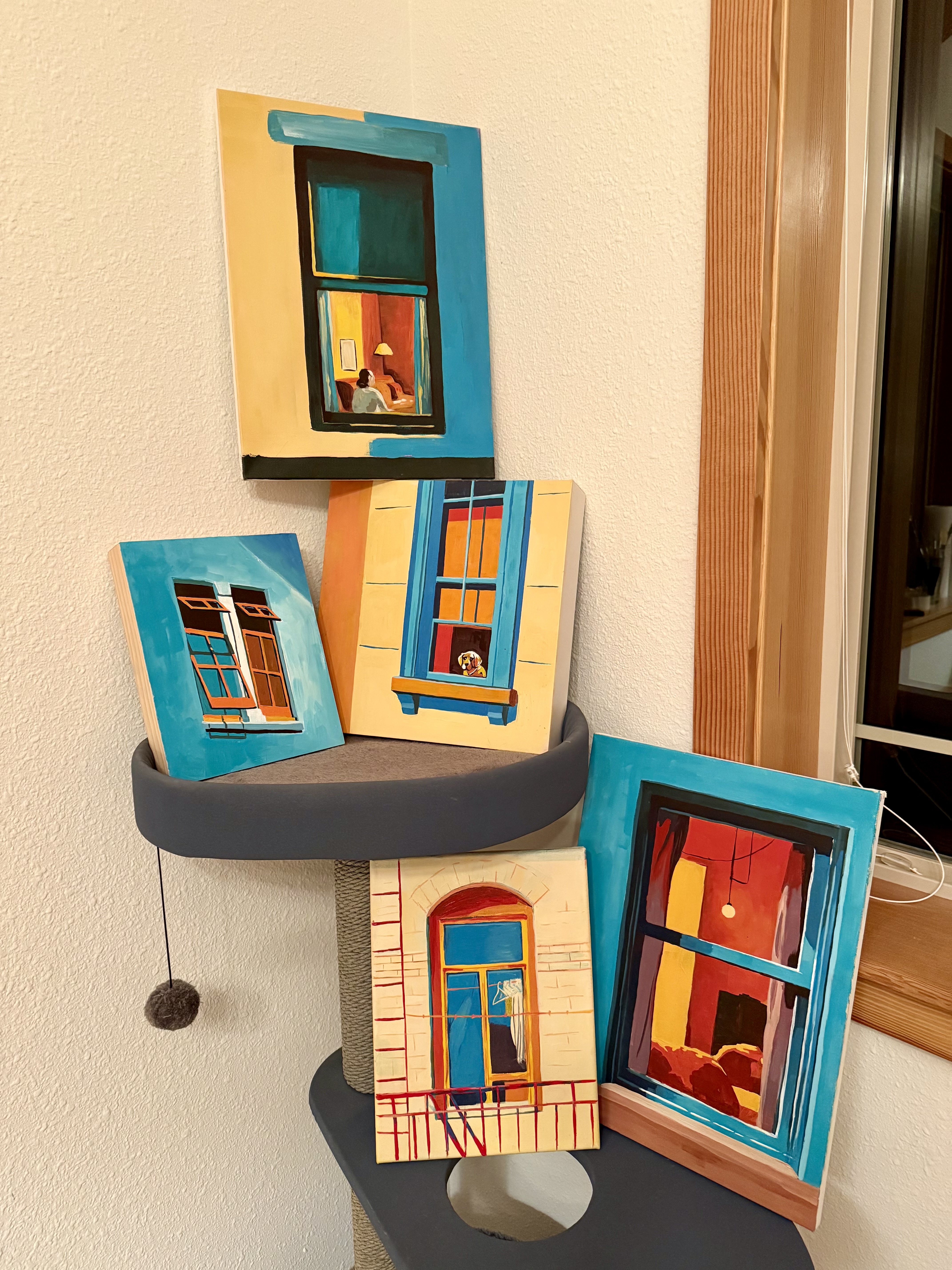 Shown together as a series. The cat tree isn't part of the art, but it is oddly structural.